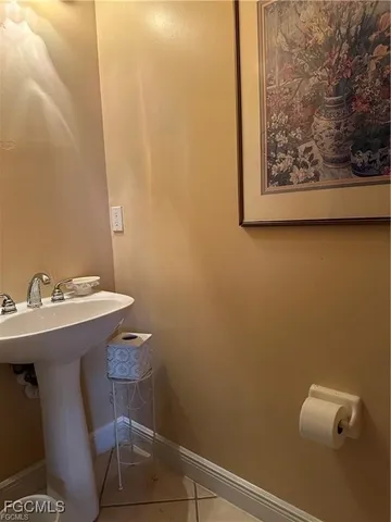 a bathroom with a sink and mirror