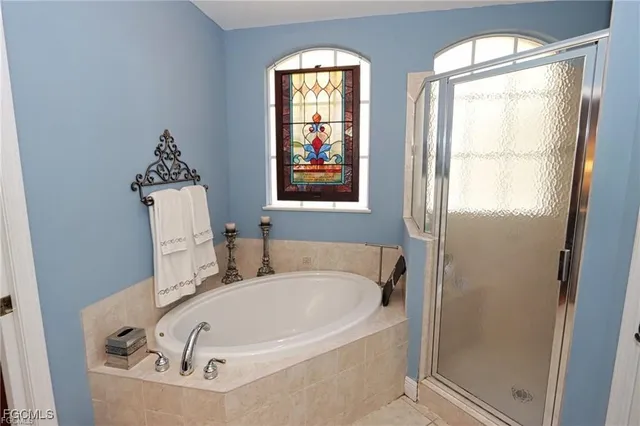 a bath tub sitting next to a window