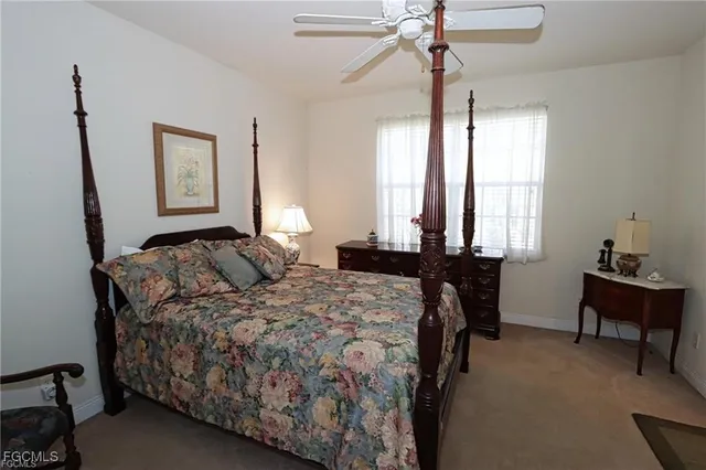 a bedroom with a bed and a table