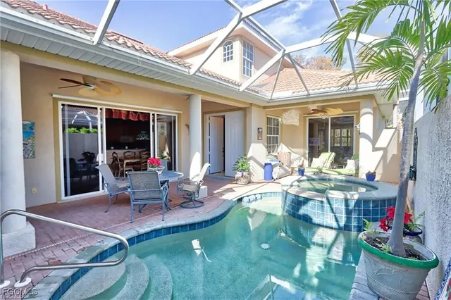 a view of a chairs and table in a patio