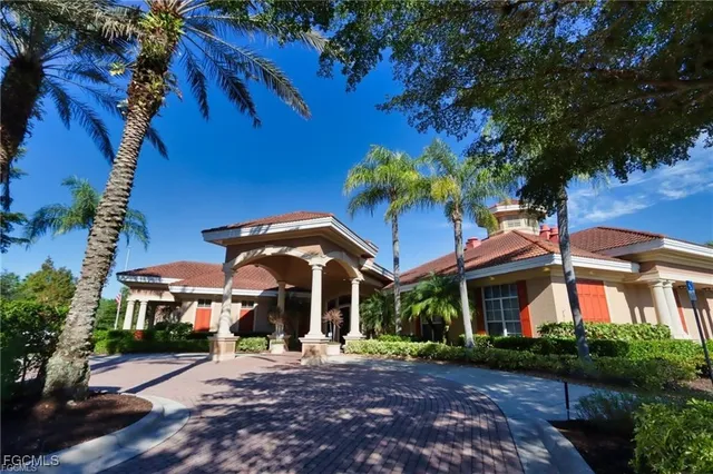 a view of a cafe with a table and chairs under an umbrella