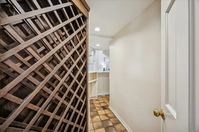 a very nice looking room with a large window and chandelier