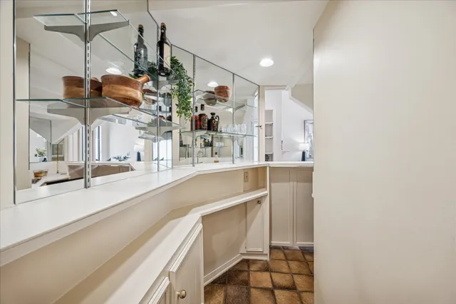 an empty room with ceiling fan and a window