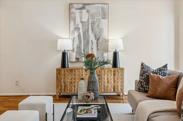 a living room with furniture and a lamp