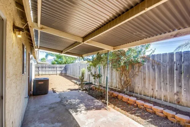 a view of backyard with small cabin