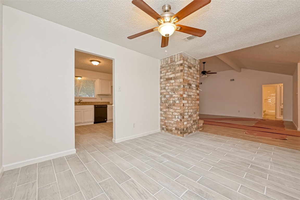5302 Oaklynn Drive Spring, TX 77373 - Photo 2 of 15 an empty room with chandelier fan and windows