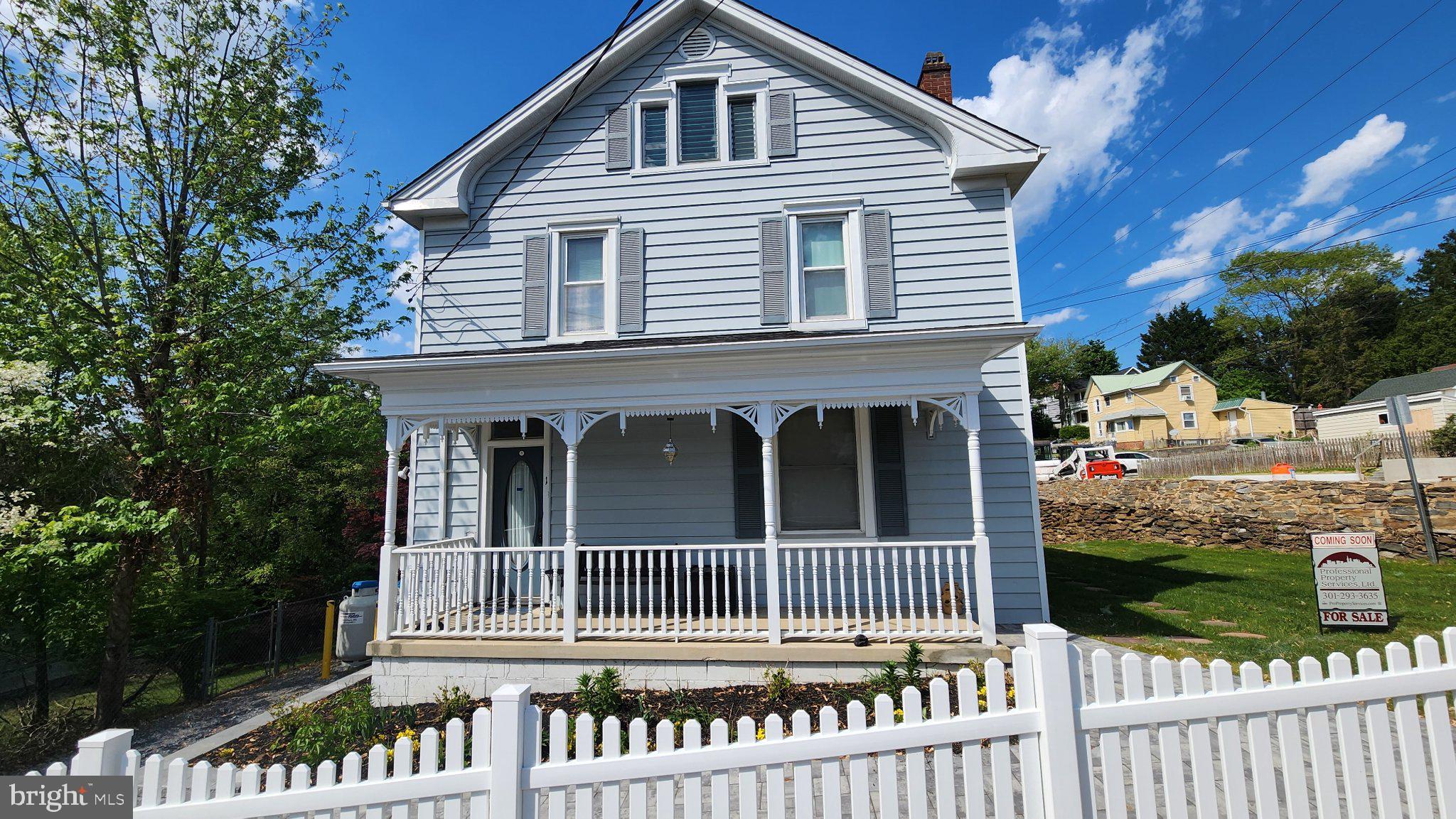 1 West E Street Brunswick, MD 21716 - Photo 1 of 7 Charming blue home with inviting porch.