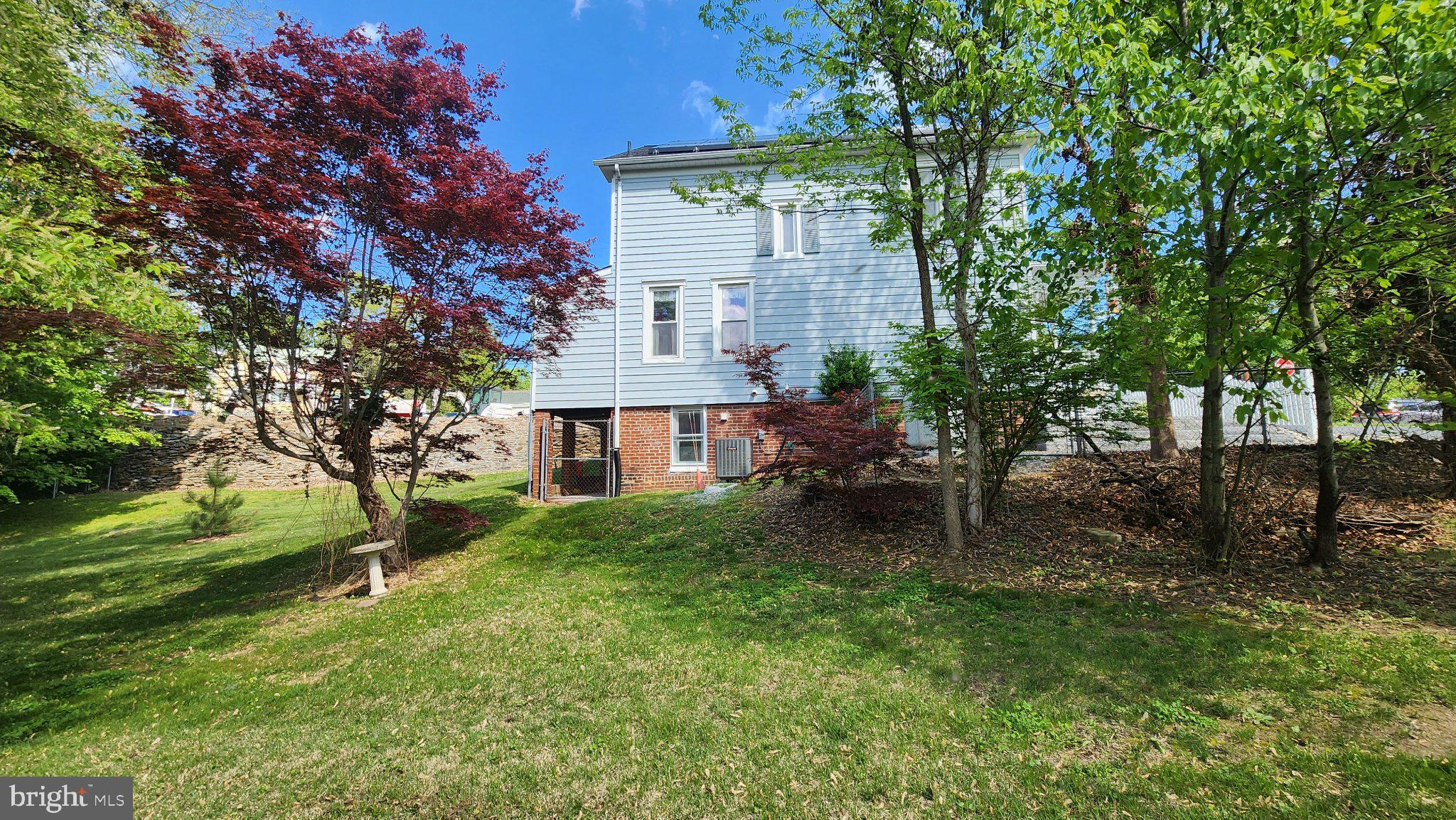 1 West E Street Brunswick, MD 21716 - Photo 7 of 7 Charming home nestled in lush greenery.