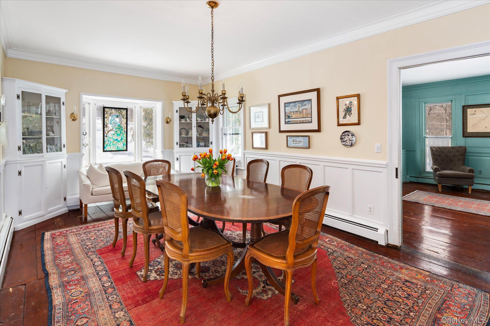 28 Barnes Road Ossining, NY 10562 - Photo 11 of 34 a view of a dining room with furniture wooden floor and chandelier