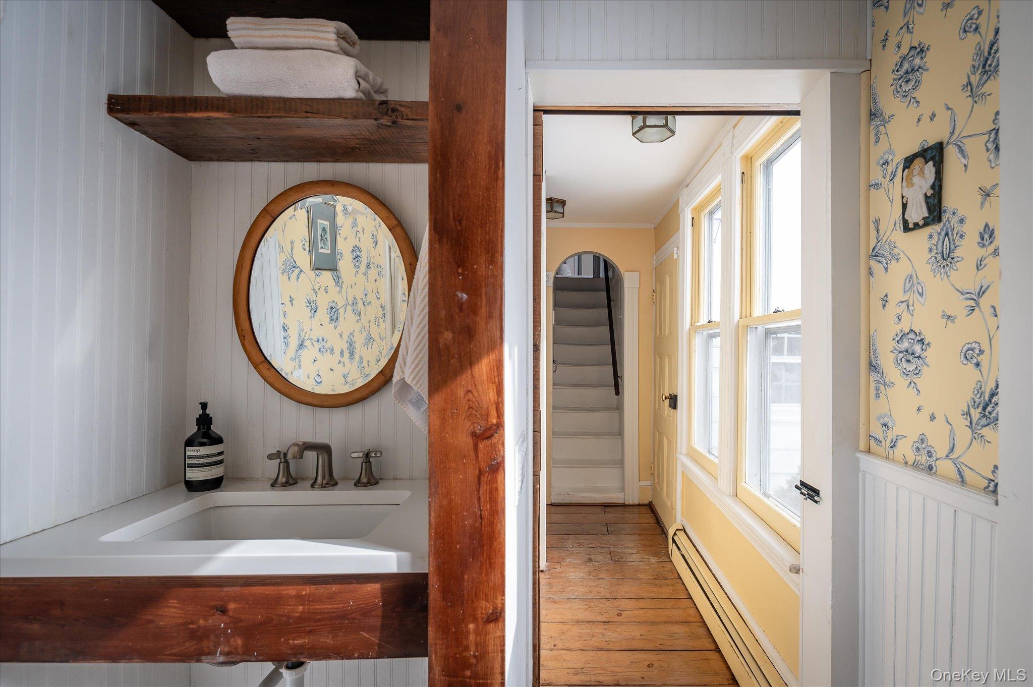 28 Barnes Road Ossining, NY 10562 - Photo 13 of 34 a bathroom with a granite countertop sink and a mirror