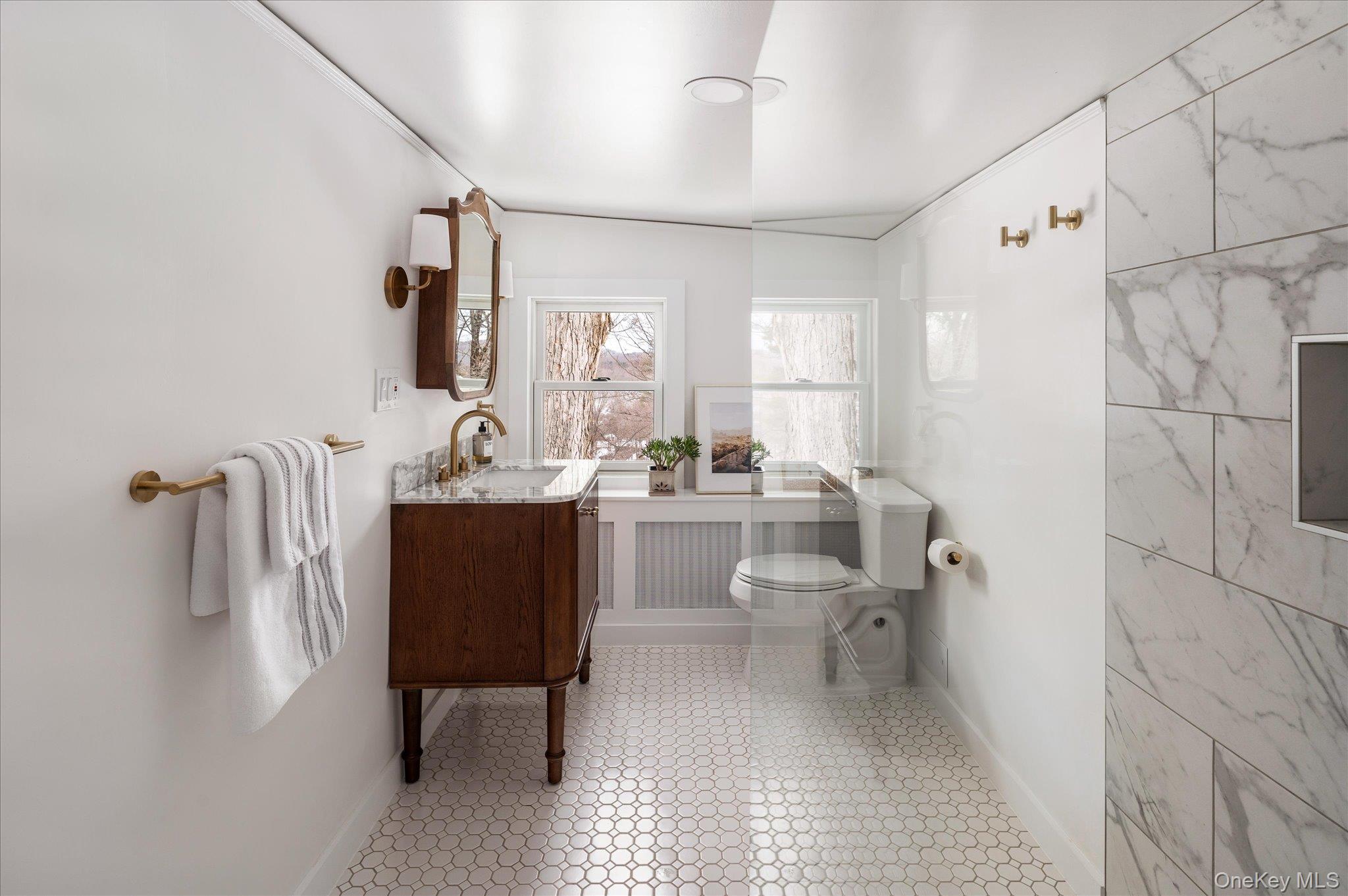 28 Barnes Road Ossining, NY 10562 - Photo 19 of 34 a bathroom with a sink a toilet and a mirror
