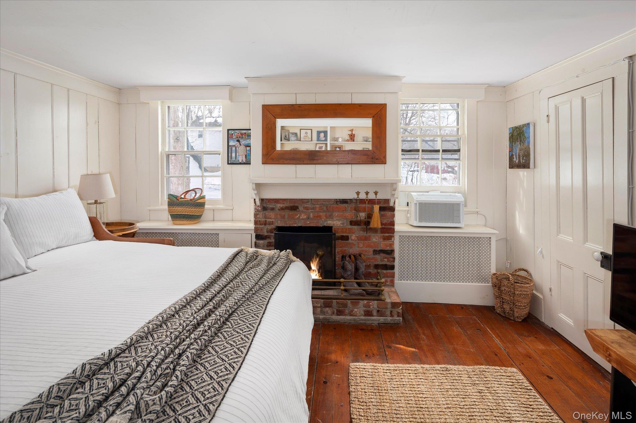 28 Barnes Road Ossining, NY 10562 - Photo 20 of 34 a bedroom with a bed and a fireplace