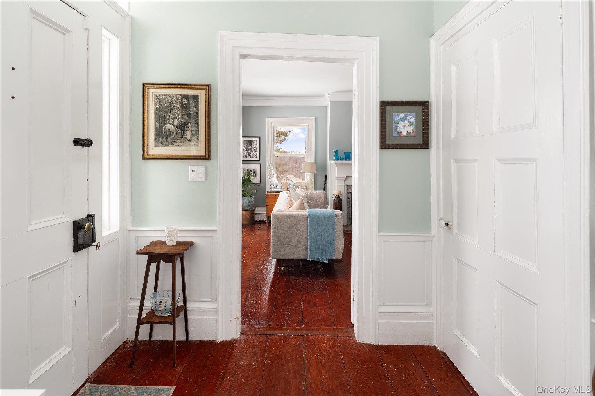 28 Barnes Road Ossining, NY 10562 - Photo 2 of 34 a view of a hallway with wooden floor and a livingroom
