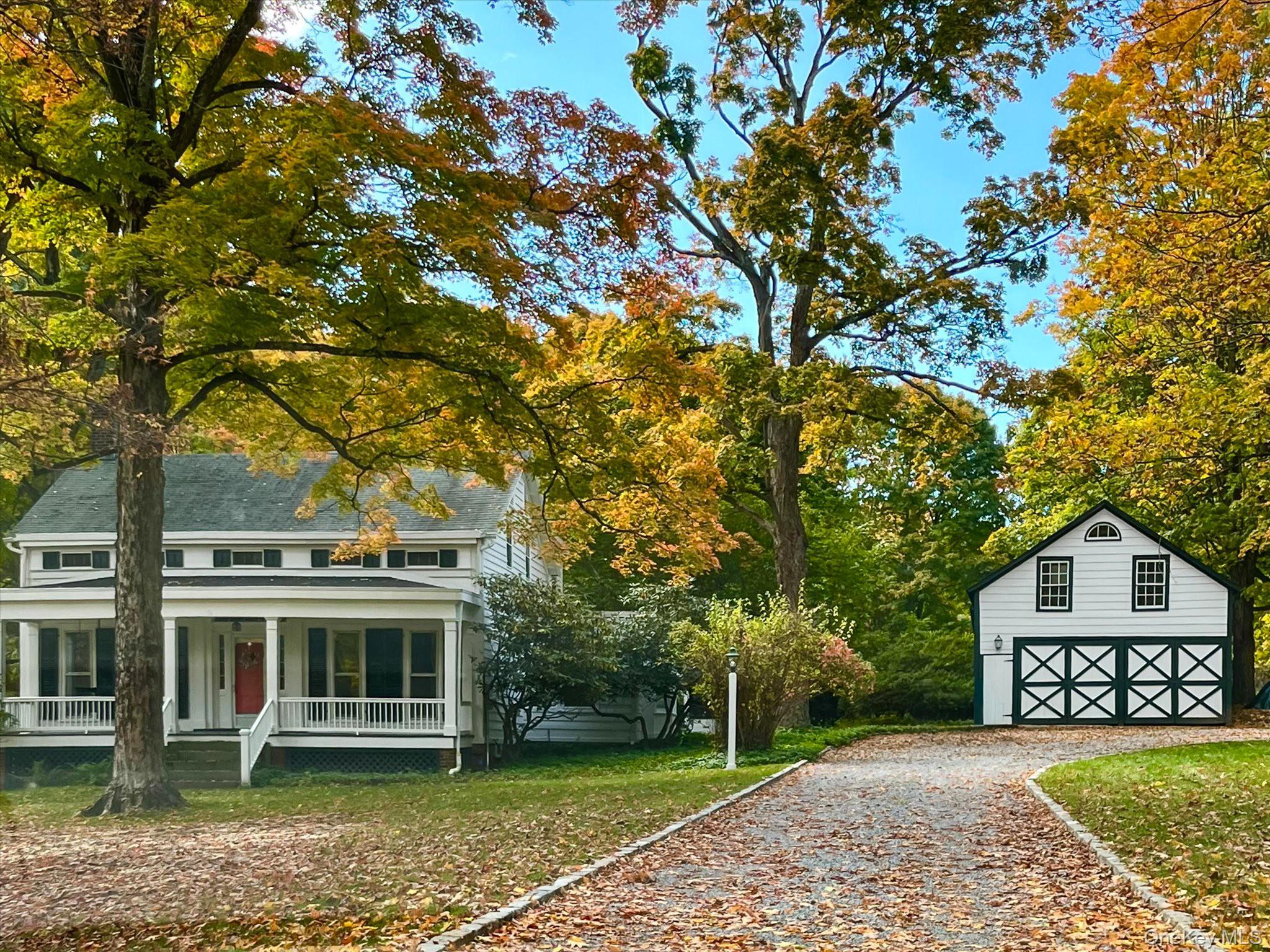 28 Barnes Road Ossining, NY 10562 - Photo 29 of 34 a view of a white house with a big yard and large tree