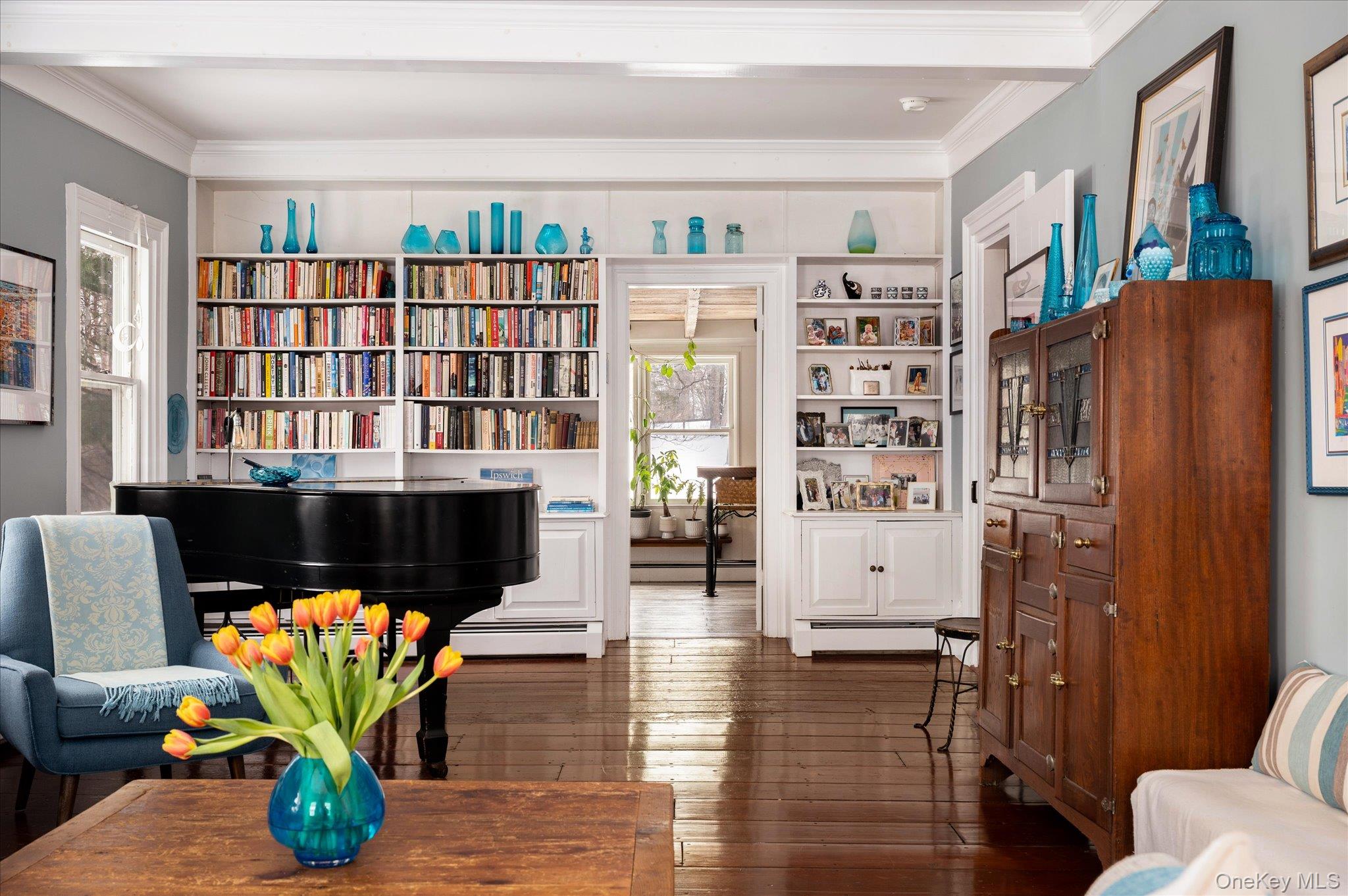 28 Barnes Road Ossining, NY 10562 - Photo 6 of 34 a living room with fireplace furniture and a book shelf