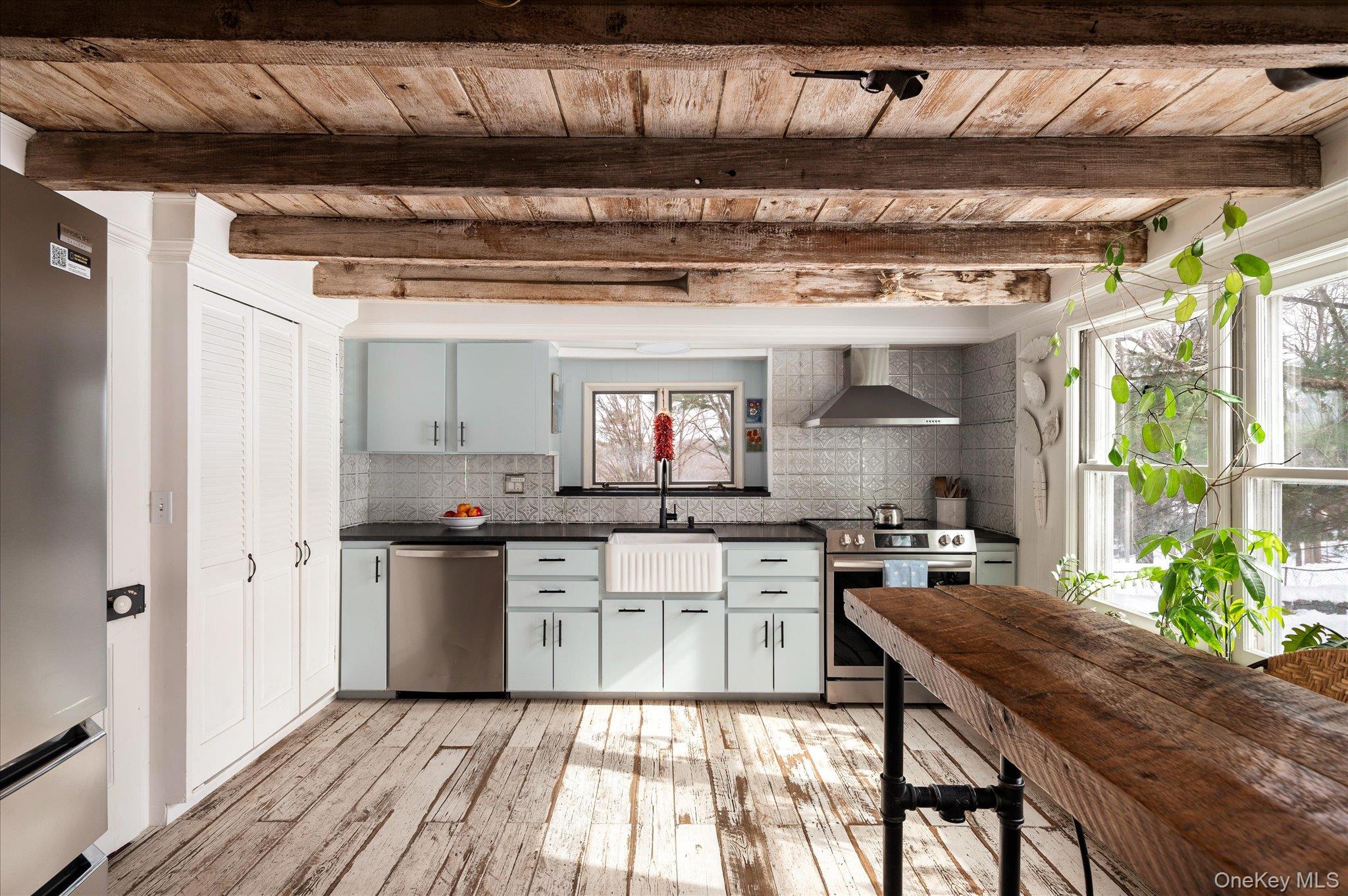 28 Barnes Road Ossining, NY 10562 - Photo 7 of 34 a kitchen with stainless steel appliances granite countertop a sink a stove and a refrigerator