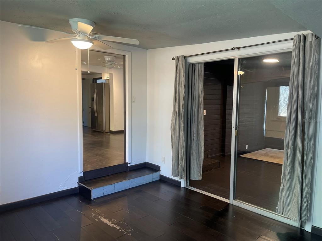 10140 Lake Louisa Road, Unit A Clermont, FL 34711 - Photo 11 of 18 wooden floor in an empty room