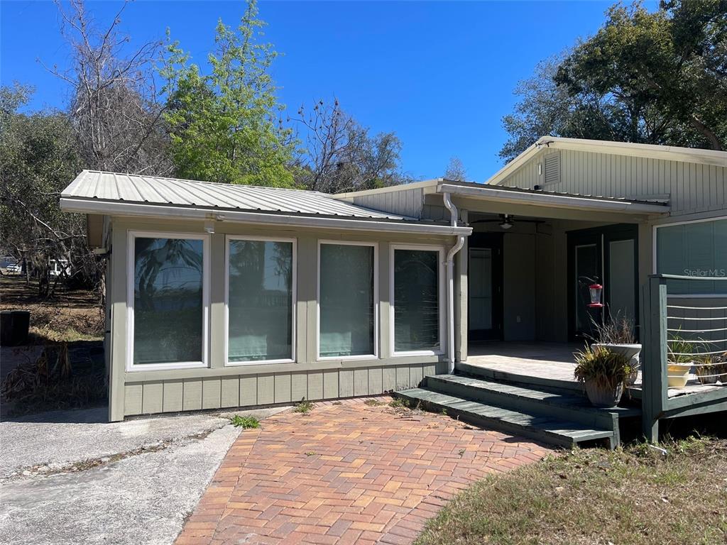 10140 Lake Louisa Road, Unit A Clermont, FL 34711 - Photo 18 of 18 a view of a house with a large window and wooden fence