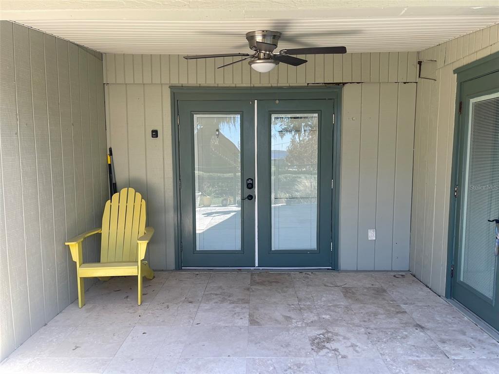 10140 Lake Louisa Road, Unit A Clermont, FL 34711 - Photo 2 of 18 a view of a livingroom with a chair and table