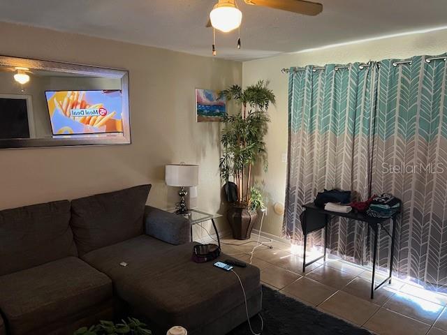 209 Ridge Crest Loop Minneola, FL 34715 - Photo 12 of 33 a living room with furniture and a large window