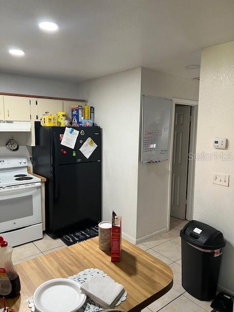 209 Ridge Crest Loop Minneola, FL 34715 - Photo 21 of 33 a kitchen with a sink and a stove top oven