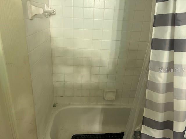 209 Ridge Crest Loop Minneola, FL 34715 - Photo 26 of 33 a bathroom with a shower and a glass door