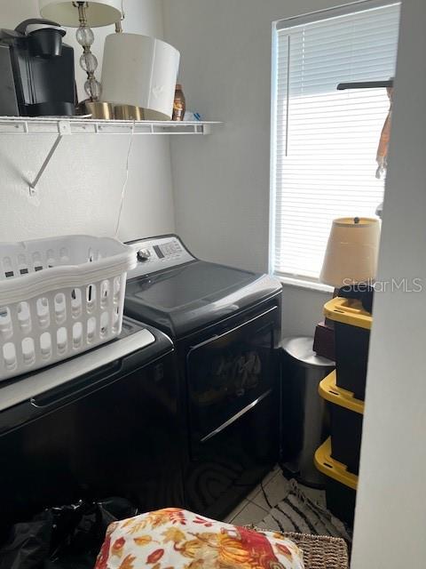 209 Ridge Crest Loop Minneola, FL 34715 - Photo 33 of 33 a utility room with dryer and washer