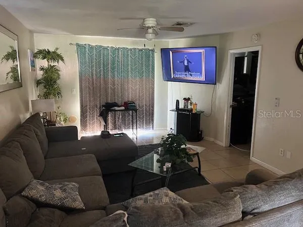 a living room with furniture and a large window