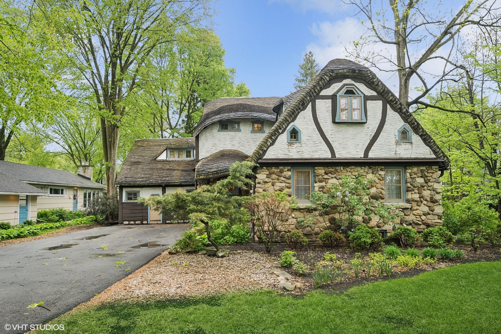 a front view of a house with garden