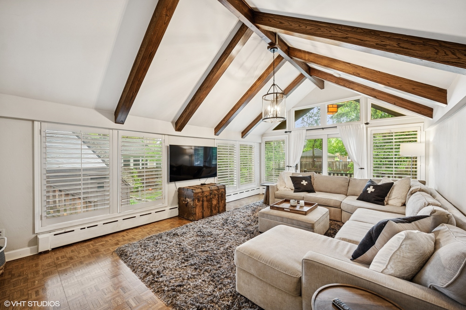 1487 Tower Road Winnetka, IL 60093 - Photo 25 of 45 a living room with furniture a flat screen tv and a large window