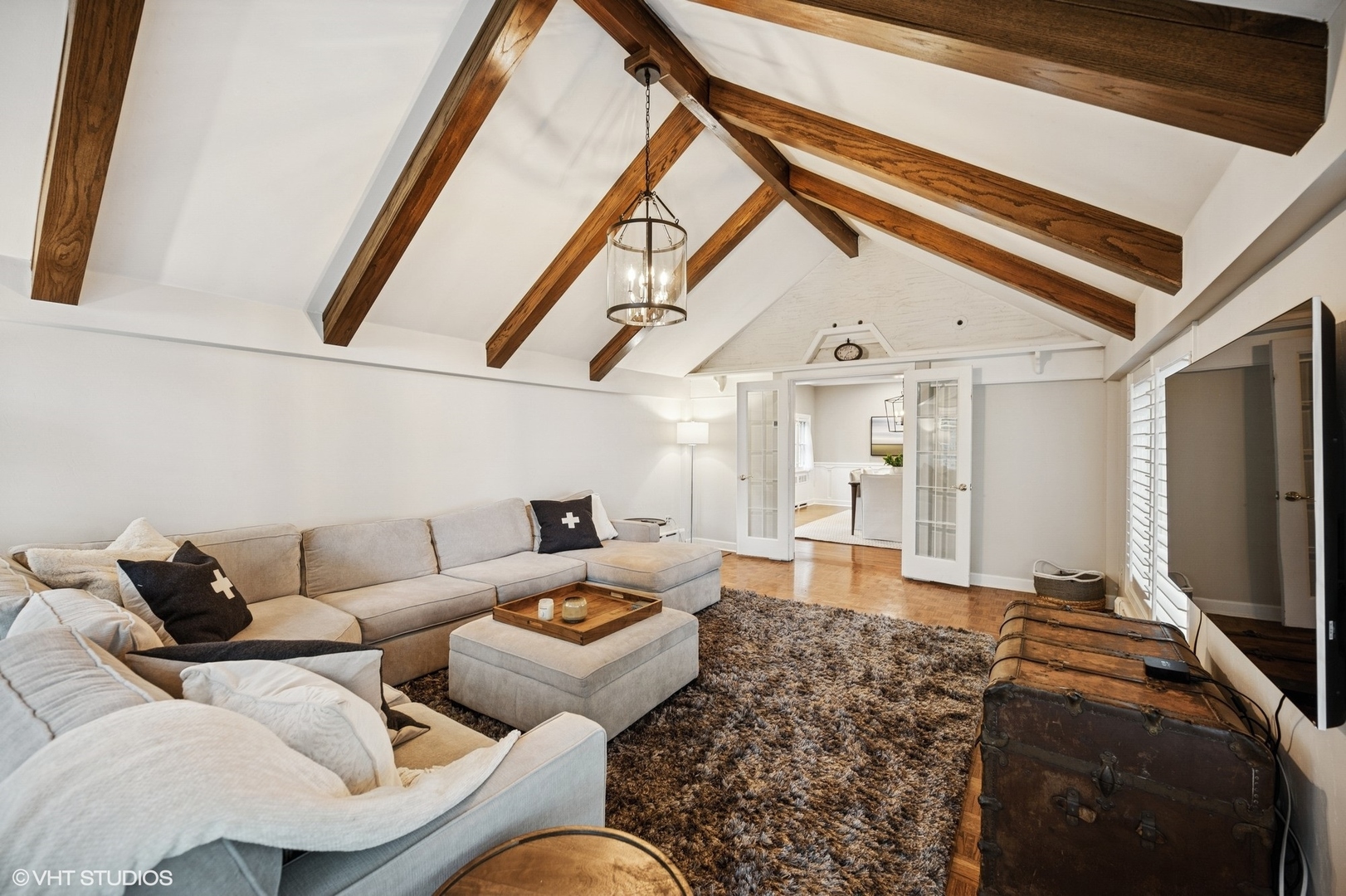 1487 Tower Road Winnetka, IL 60093 - Photo 26 of 45 a living room with furniture and a flat screen tv