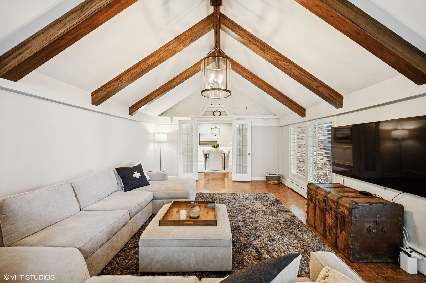 1487 Tower Road Winnetka, IL 60093 - Photo 27 of 45 a living room with furniture and a flat screen tv