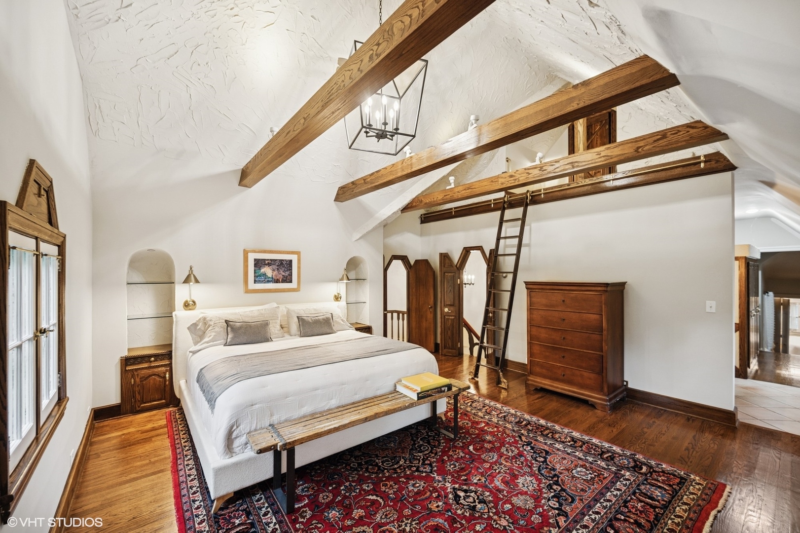 1487 Tower Road Winnetka, IL 60093 - Photo 29 of 45 a bedroom with a bed and a walk in closet