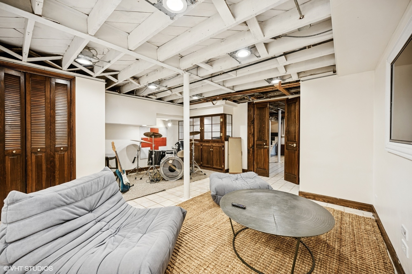 1487 Tower Road Winnetka, IL 60093 - Photo 36 of 45 a living room with furniture and a chandelier