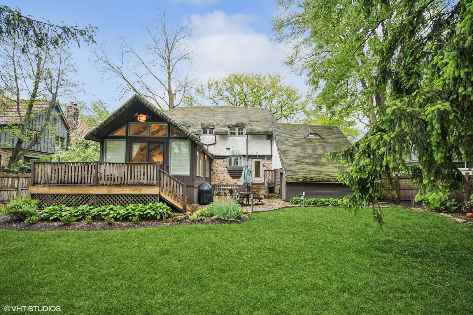 1487 Tower Road Winnetka, IL 60093 - Photo 37 of 45 a view of a house with a yard and sitting area