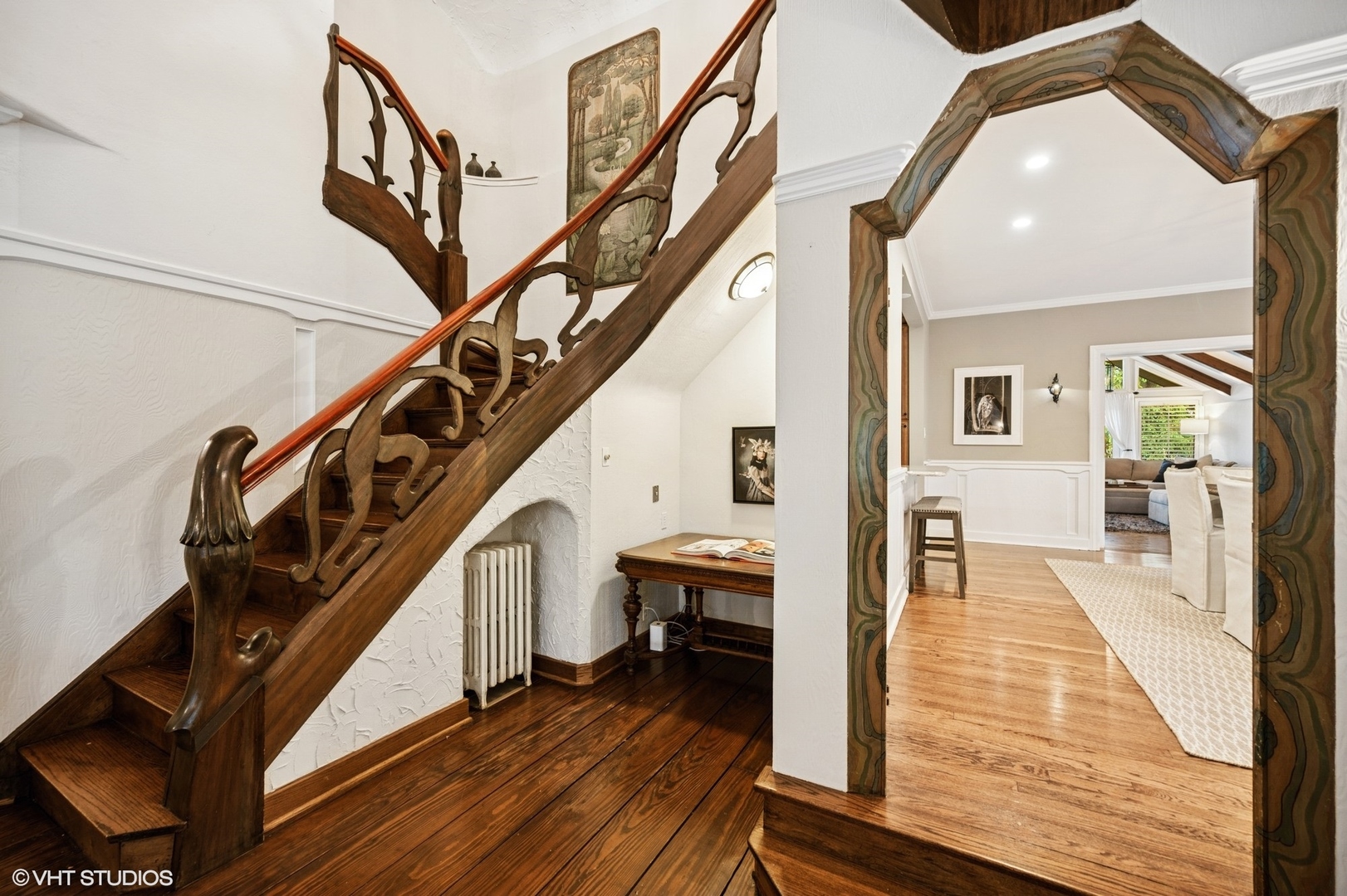 1487 Tower Road Winnetka, IL 60093 - Photo 8 of 45 a view of a hallway with wooden floor and staircase