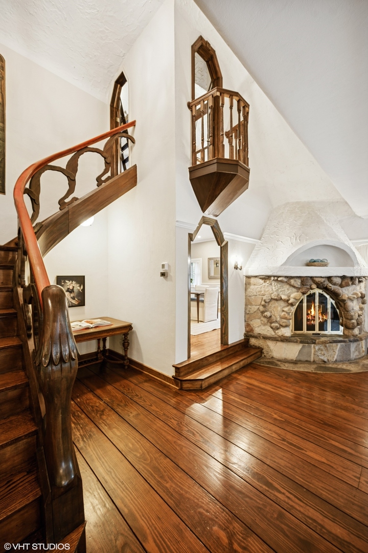 1487 Tower Road Winnetka, IL 60093 - Photo 9 of 45 a view of a livingroom with wooden floor and a ceiling fan