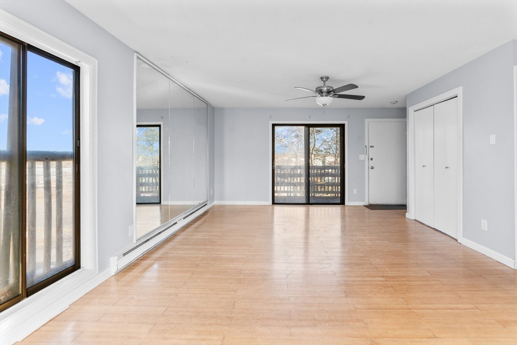 800 Bearses Way, Unit 3NF Hyannis, MA 02601 - Photo 12 of 30 wooden floor in an empty room with a window
