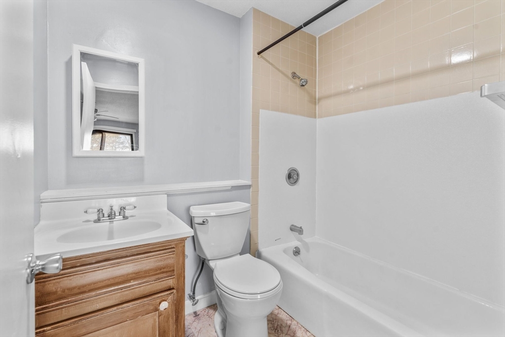 800 Bearses Way, Unit 3NF Hyannis, MA 02601 - Photo 27 of 30 a bathroom with a toilet sink and shower