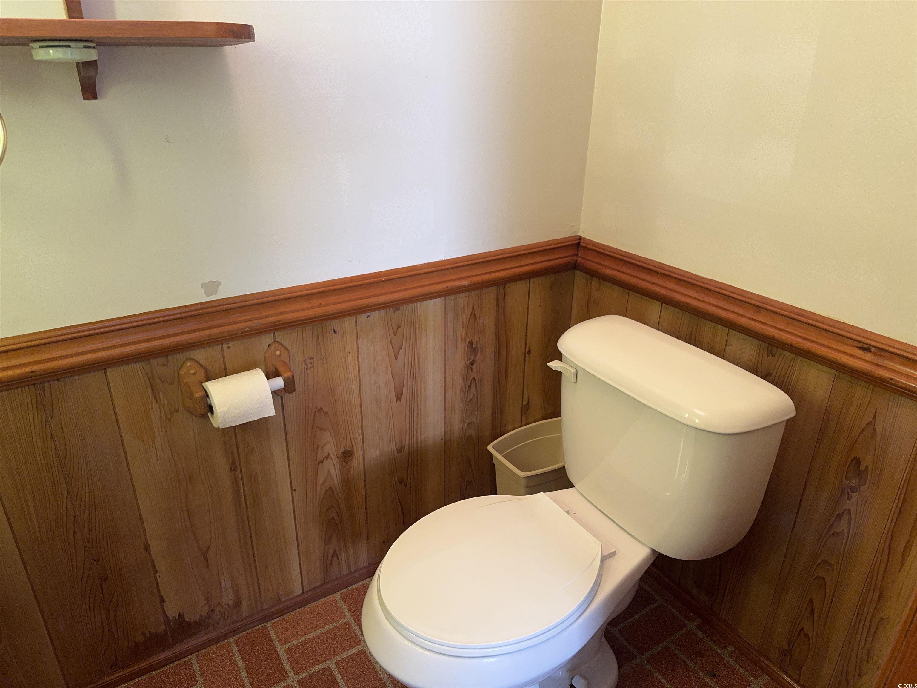 1861 Jenerette Street Mullins, SC 29574 - Photo 12 of 36 Half bathroom featuring a wainscoted wall and toilet