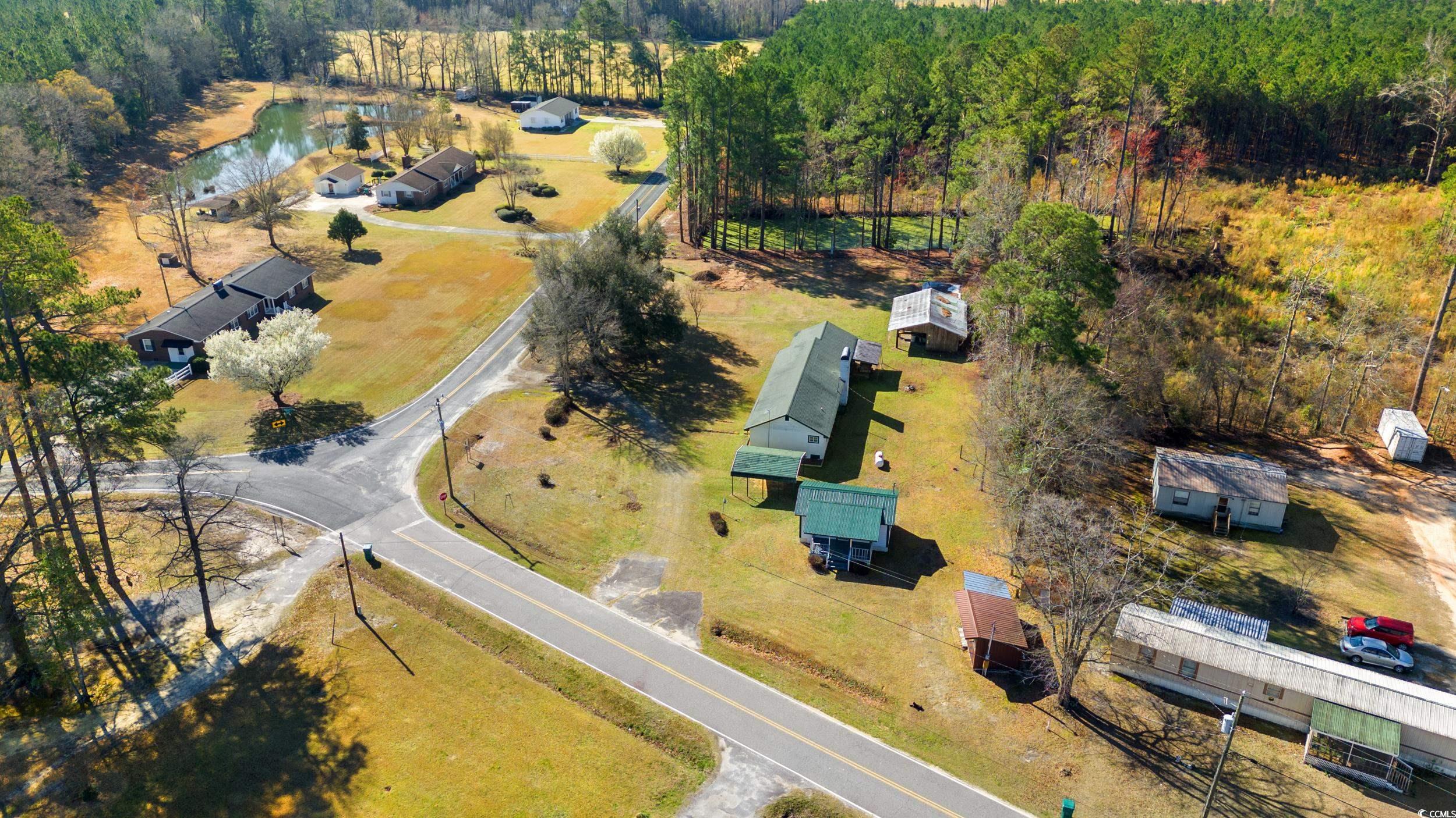 1861 Jenerette Street Mullins, SC 29574 - Photo 35 of 36 Drone / aerial view with a forest view