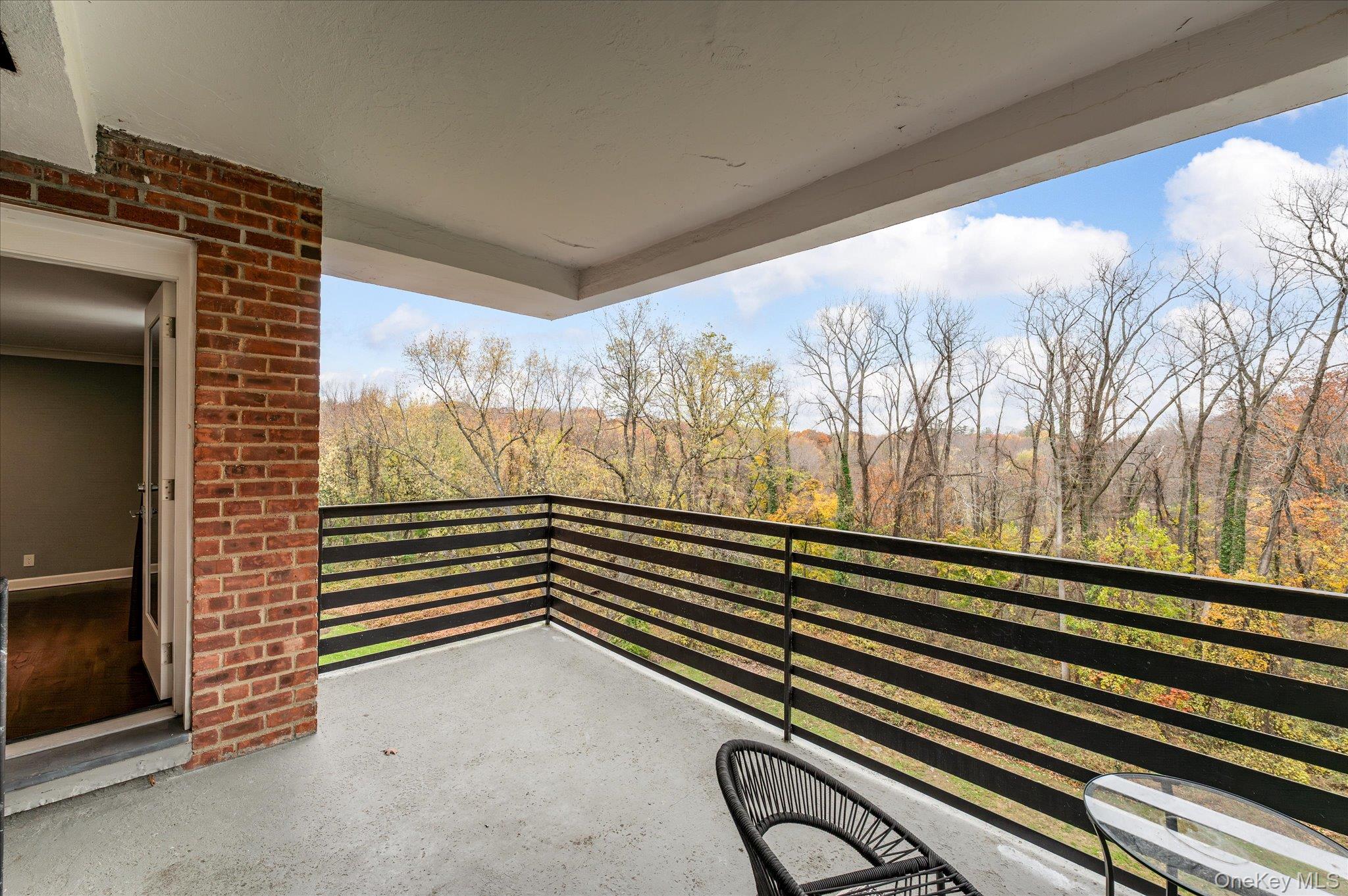 1133 Midland Avenue, Unit 4C Bronxville, NY 10708 - Photo 20 of 30 a view of a room with wooden floor and windows