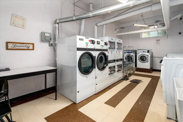 a utility room with dryer and washer