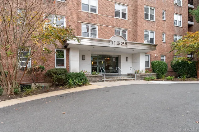 a view of a building with a yard