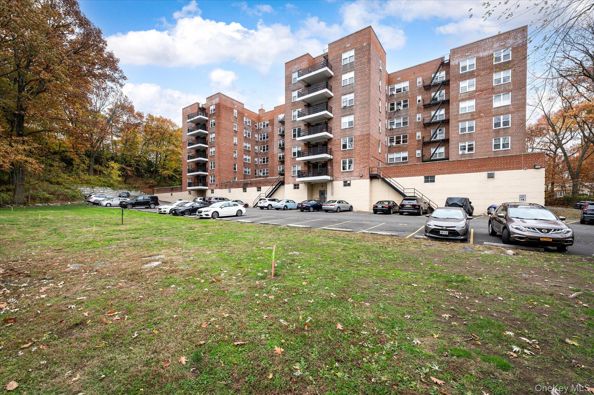 1133 Midland Avenue, Unit 4C Bronxville, NY 10708 - Photo 30 of 30 a city view with tall buildings and a yard
