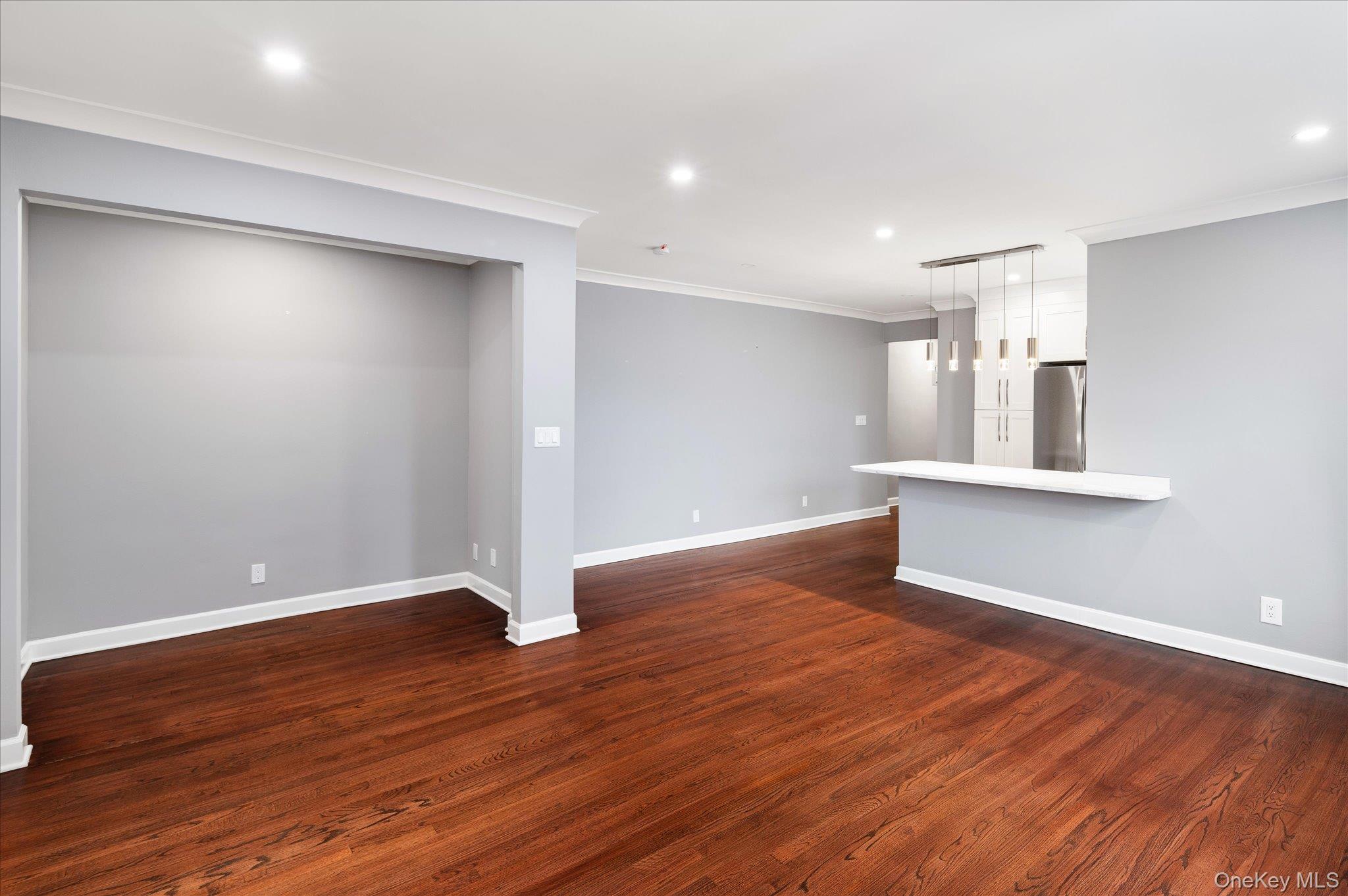 1133 Midland Avenue, Unit 4C Bronxville, NY 10708 - Photo 8 of 30 a view of empty room with wooden floor