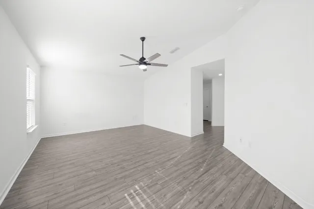 a bathroom with a granite countertop sink a mirror and a shower