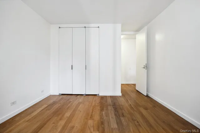 a view of wooden floor in an empty room