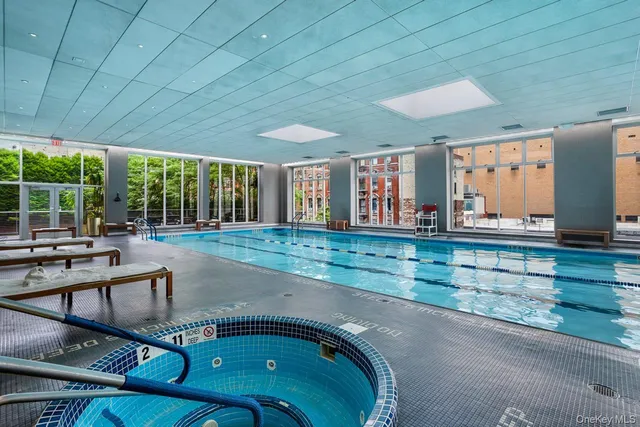 a view of swimming pool with outdoor seating