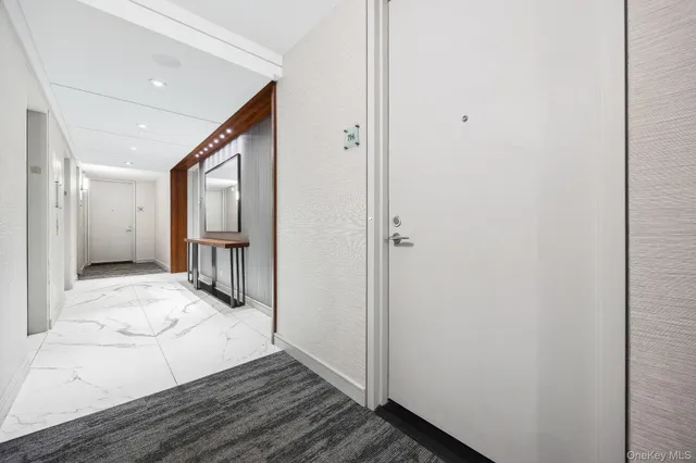 a view of hallway with wooden floor